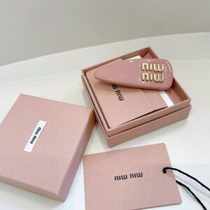 MIUMIU patent leather hair clip for women
